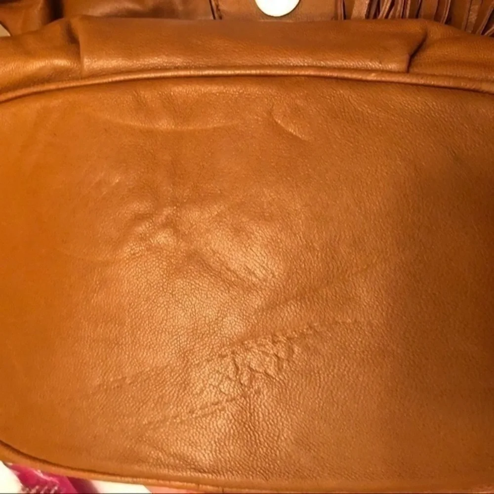 Michael kors brown leather grommet tassel bag